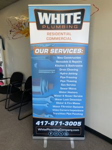 Retractable Banner Display for White Plumbing on display listing their services